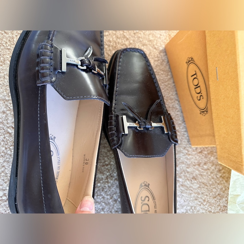 - Tod’s Slip On T Ring Loafer Flats